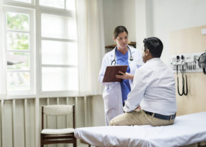 A doctor talks to a patient