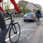 cyclists riding in the bike lane